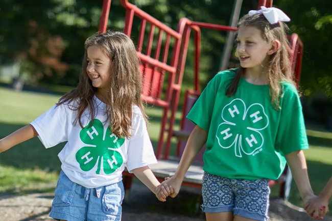 Two Cloverbud Members Holding Hands